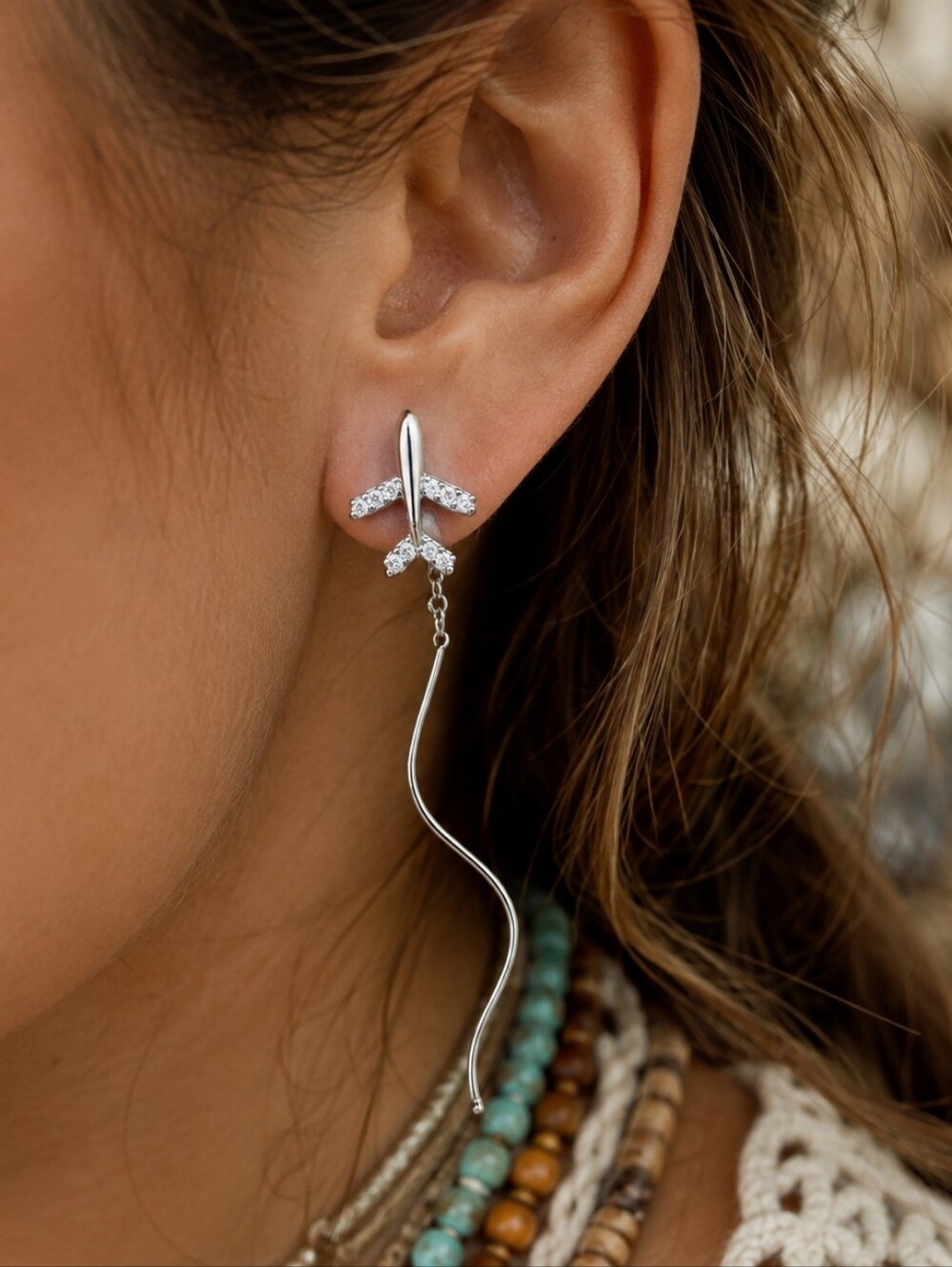 ANTHROPOLOGIE FLYING AIRPLANE EARRINGS